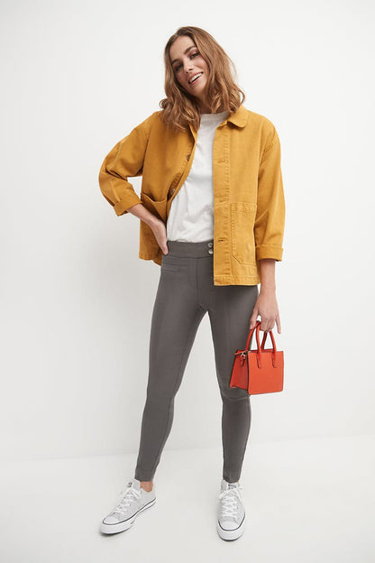 Skinny ankle pants with snaps